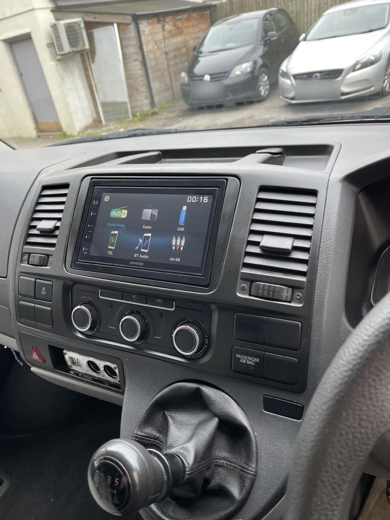 A touchscreen stereo fitted beside the original dashboard controls.