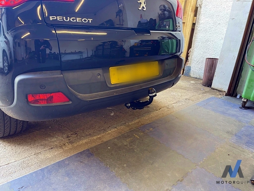 Rear of a Peugeot 3008 showing its fitted towbar