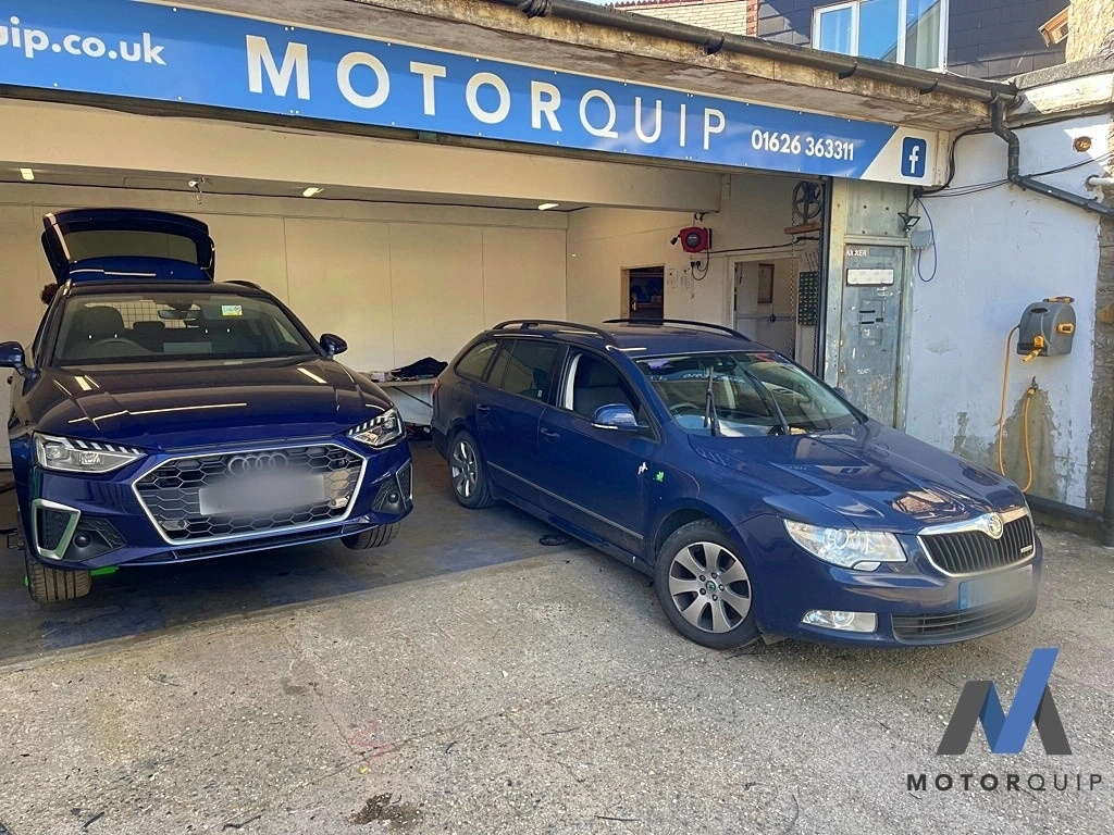 Audi A4 and Skoda parked outside the Motorquip workshop