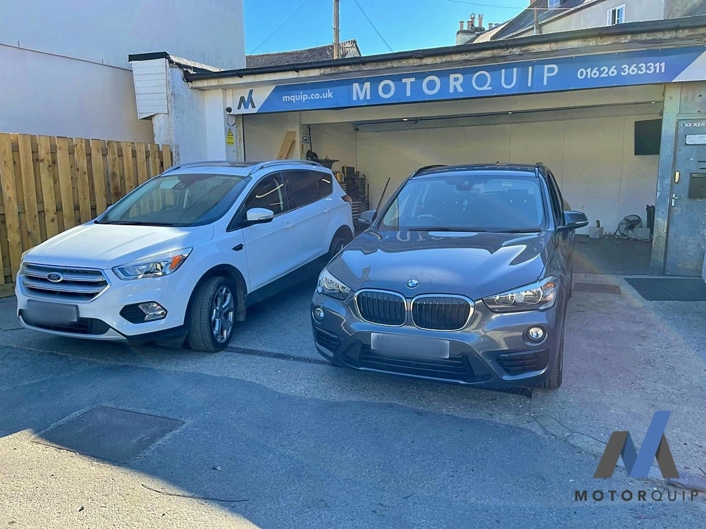 BMW and Ford parked outside the Motorquip workshop